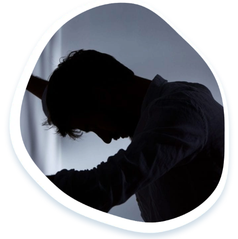 Person grieving in the dark
